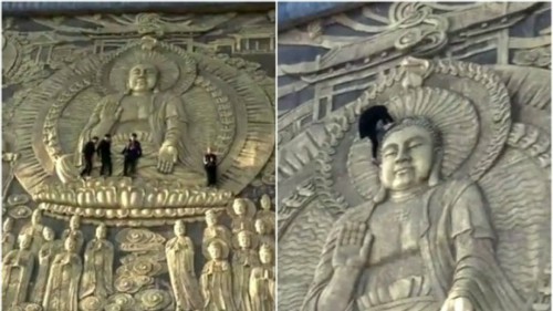 Khách Trung Quốc trèo lên bức điêu khắc Phật khổng lồ - Ảnh 1.