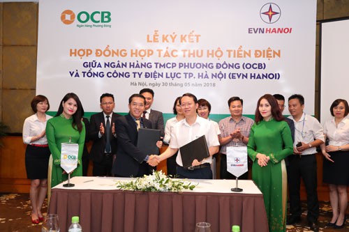 OCB và EVN HANOI hợp tác thu hộ tiền điện - Ảnh 1.