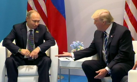 Ngôn ngữ cơ thể của tổng thống Nga - Mỹ trong cuộc họp đầu tiên - Ảnh 2.