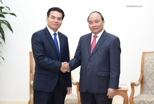 Việt - Lào chia sẻ kinh nghiệm điều hành kinh tế - Ảnh 1.