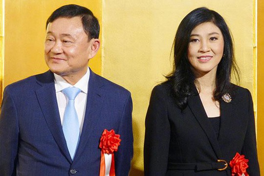 Ông Thaksin và bà Yingluck tươi cười ở Nhật Bản - Ảnh 1.