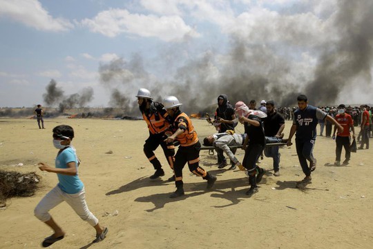 Ngày đẫm máu ở Gaza: Bé 8 tháng tuổi thiệt mạng vì khí cay - Ảnh 7.