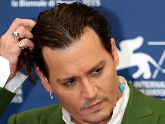 Cướp biển Johnny Depp dàn xếp êm vụ kiện 25 triệu USD - Ảnh 1.