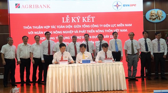 EVNSPC ký kết thỏa thuận hợp tác với Agribank - Ảnh 1.