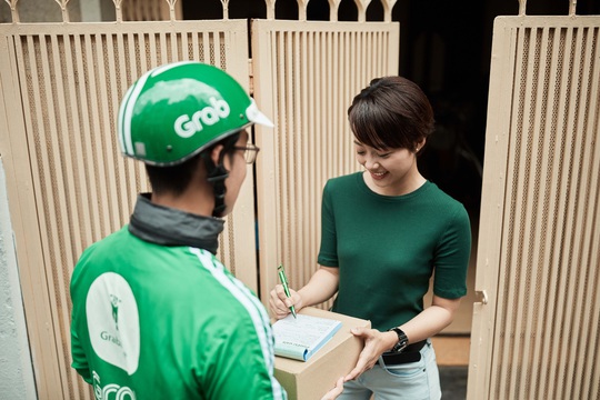 Grab và Shopee hợp tác triển khai dịch vụ “Giao hàng 1 giờ” - Ảnh 1.