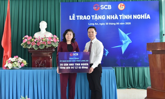 SCB tài trợ 1,2 tỉ đồng xây 20 căn nhà tình nghĩa - Ảnh 1.