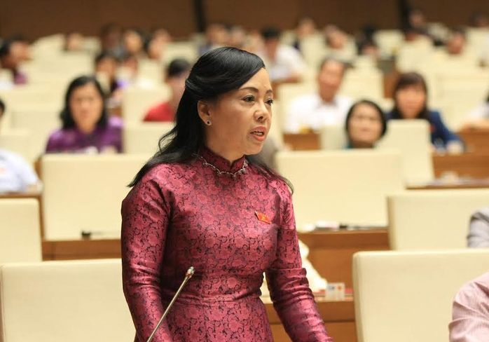 Bộ trưởng Nguyễn Thị Kim Tiến đăng đàn trả lời chất vấn - Ảnh 4.