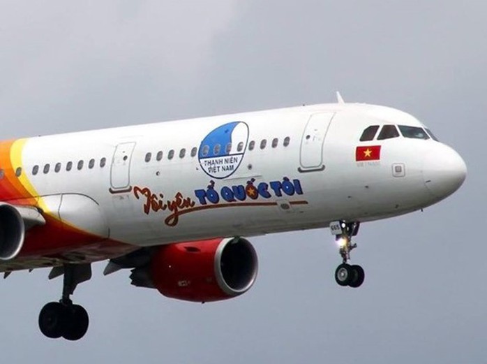 Máy bay Tôi yêu Tổ quốc tôi của Vietjet đưa sinh viên, công nhân về quê ăn Tết - Ảnh 1.