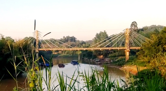 Công an vào cuộc điều tra vụ mãi lộ xe quá tải qua cầu ở Lâm Đồng - Ảnh 1.
