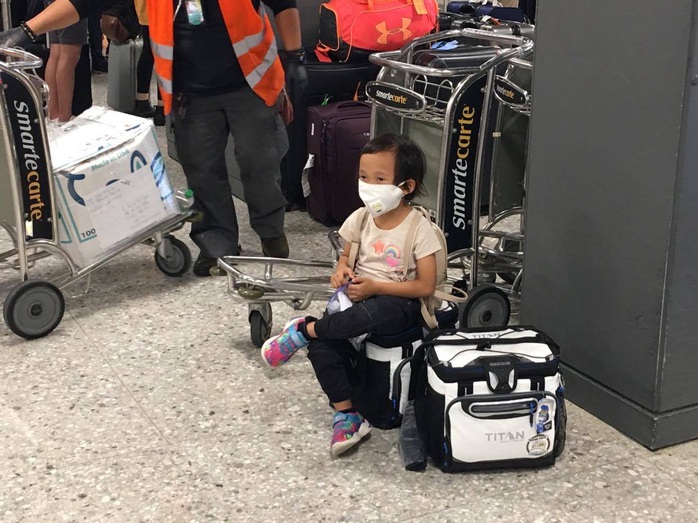 346 người Việt từ Mỹ về nước tại sân bay Nội Bài - Ảnh 5.