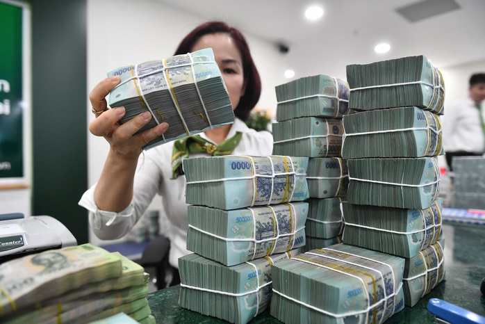 Lãi suất cho vay không giảm kịp theo lãi huy động - Ảnh 1. Lãi suất cho vay không giảm kịp theo lãi huy động - Ảnh 1.