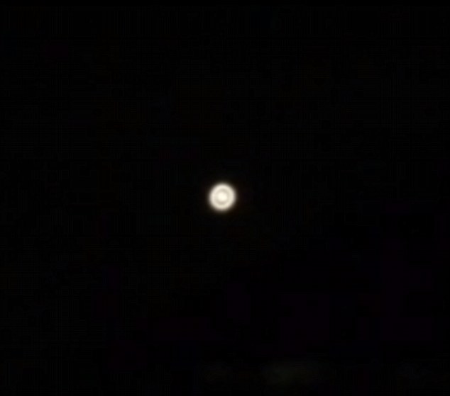 Mysterious: This strange light was seen hovering in the sky above Eltham in South London on Monday night