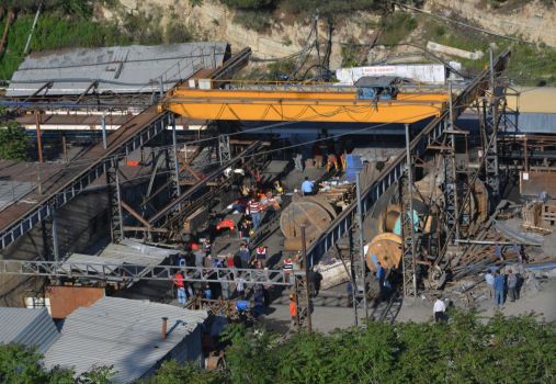 Rescue workers at the entrance of the mine after an explosion and fire at a coal mine in Soma, in western Turkey, Tuesday, May 13, 2014.  An explosion and fire at a coal mine in western Turkey killed at least one miner Tuesday and left up to 300 workers trapped underground, a Turkish official said. Twenty people were rescued from the mine in the town of Soma in Manisa province but one later died in the hospital, Soma administrator Mehmet Bahattin Atci told reporters. The town is 250 kilometers (155 miles) south of Istanbul.  TURKEY OUT Photo: IHA, AP / IHA