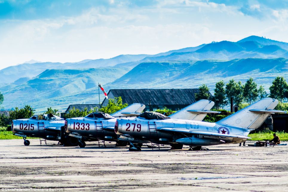 Danish photographer Pedersen said he didnt believe any of the stories the tour guides told him, and noticed that fake buildings had been set up to trick him (pictured, jets on a runway in Chilbosan)