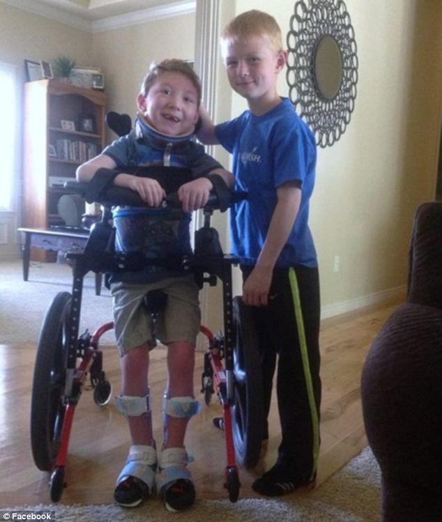 Best friends: Noah called his younger brother, who cannot walk or talk or eat on his own, perfect