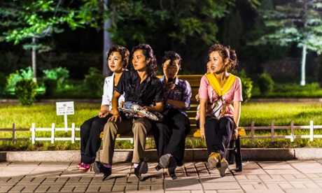 Women sit in the Kaeson Youth Park in Pyongyang, North Korea.