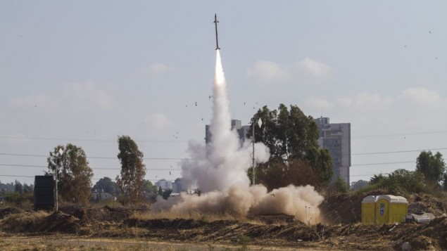 An Iron Dome air defense system fires to intercept a rocket from the Gaza Strip in Tel Aviv, Israel, on Wednesday, July 9, 2014. (photo credit: AP/Dan Balilty)