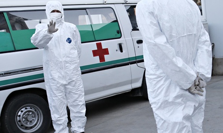 North Korean healthcare workers wear protective suits Ebola