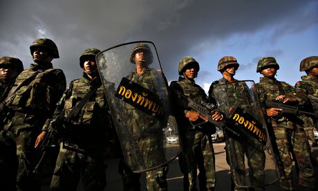 Thai soldiers stand guard during a coup at the Army Club in central Bangkok