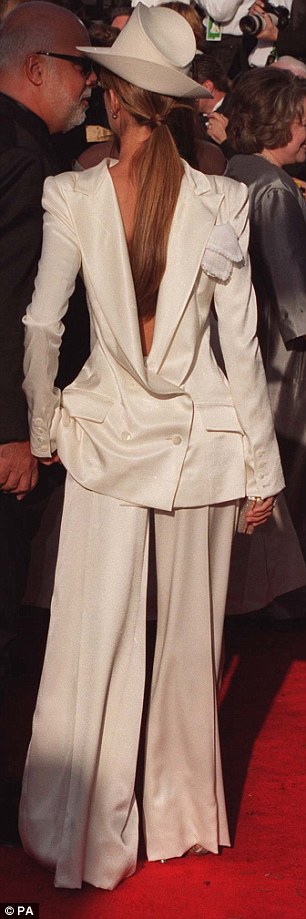 Celine Dion clearly thought she looked a bit of all white in this bizarre back to front suit at the 71st Ocars in 1999Read more: http://www.dailymail.co.uk/femail/article-2570154/FROCK-HORRORS-The-worst-Oscar-dresses-time.html#ixzz2uguEmK4n Follow us: @MailOnline on Twitter | DailyMail on Facebook