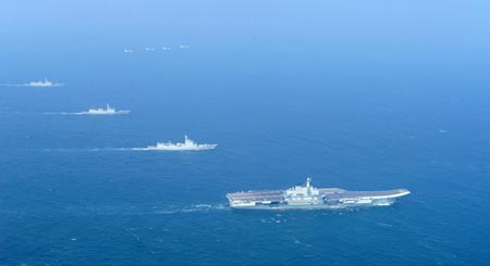 Chinas first aircraft carrier Liaoning and support ships on the way back from sea trials in the South China Sea, Jan. 1. (Photo/CNS)