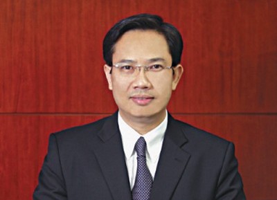 Ông Lê Minh Tâm, người Việt hiếm hoi được bổ nhiệm làm tổng giám đốc một ngân hàng nước ngoài. Ảnh: DNSG
