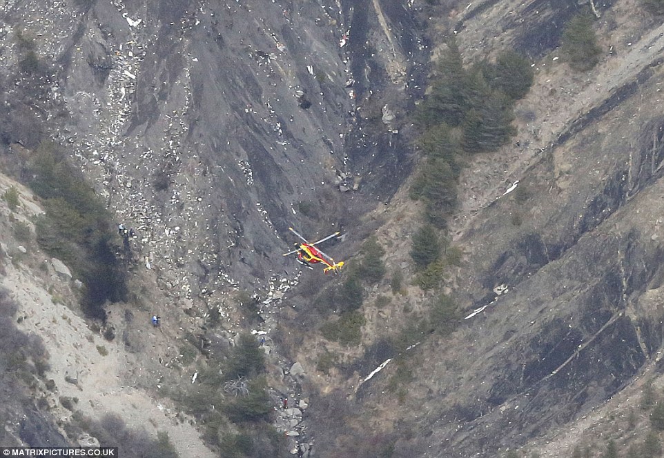 Disaster: A rescue helicopter flies over wreckage of a Germanwings Airbus A320 plane that crashed between the towns of Barcelonnette and Digne in the French Alps. All 150 people on board - including two babies and 16 children from the same German school - died in the crash