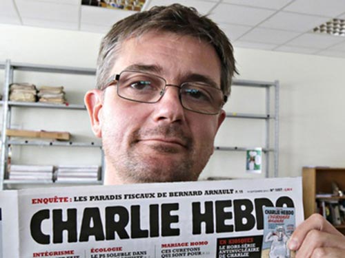 Stephane Charbonnier in đậm dấu ấn bằng các tác phẩm biếm họa trên tạp chí Charlie Hebdo. Ảnh: AP