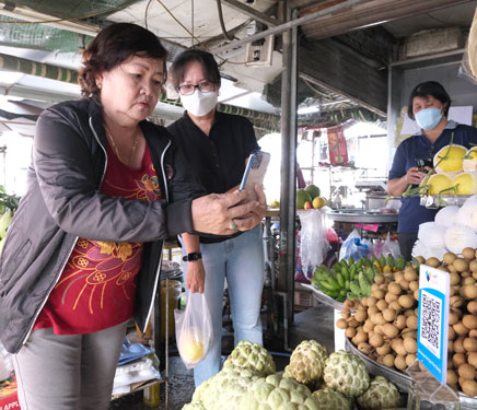 Đi chợ không cần mang tiền - Ảnh 1.