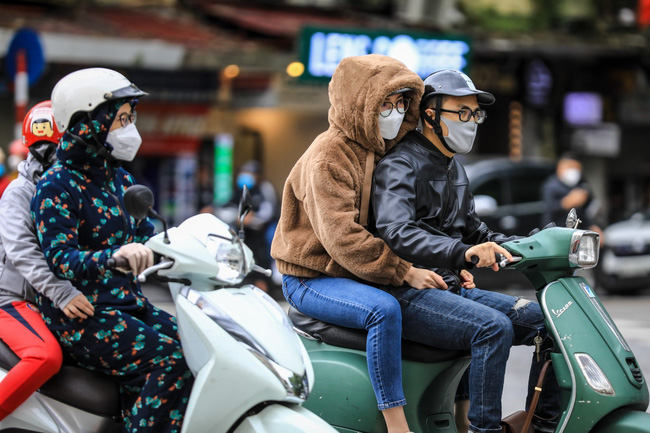 Không khí lạnh miền Bắc giảm nhiệt độ xuống dưới 8 độ , mưa lớn ảnh hưởng đến nhiều nơi - Ảnh 1.