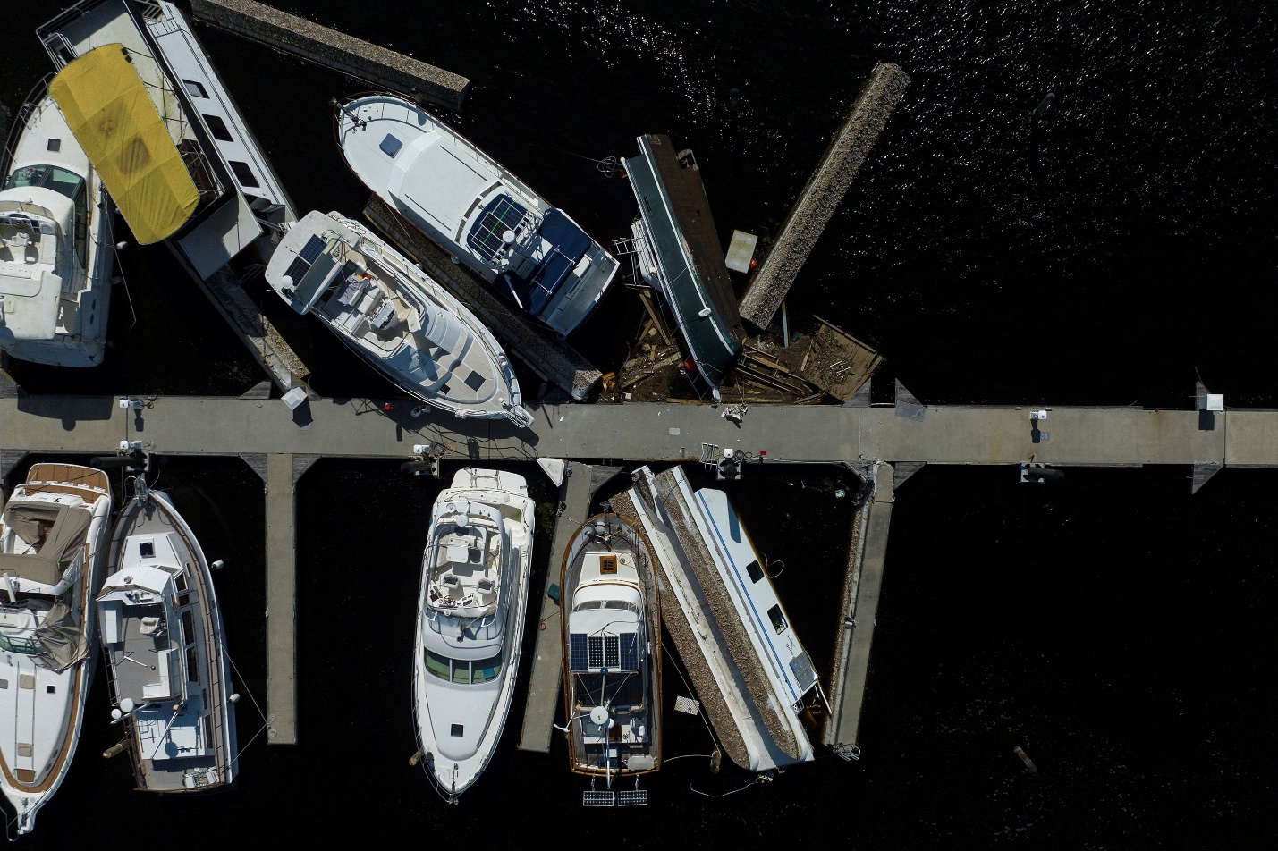 Boats are piled up on a pier after they were washed ashore when Hurricane Milton passed through Punta Gorda, Florida, on Thursday.