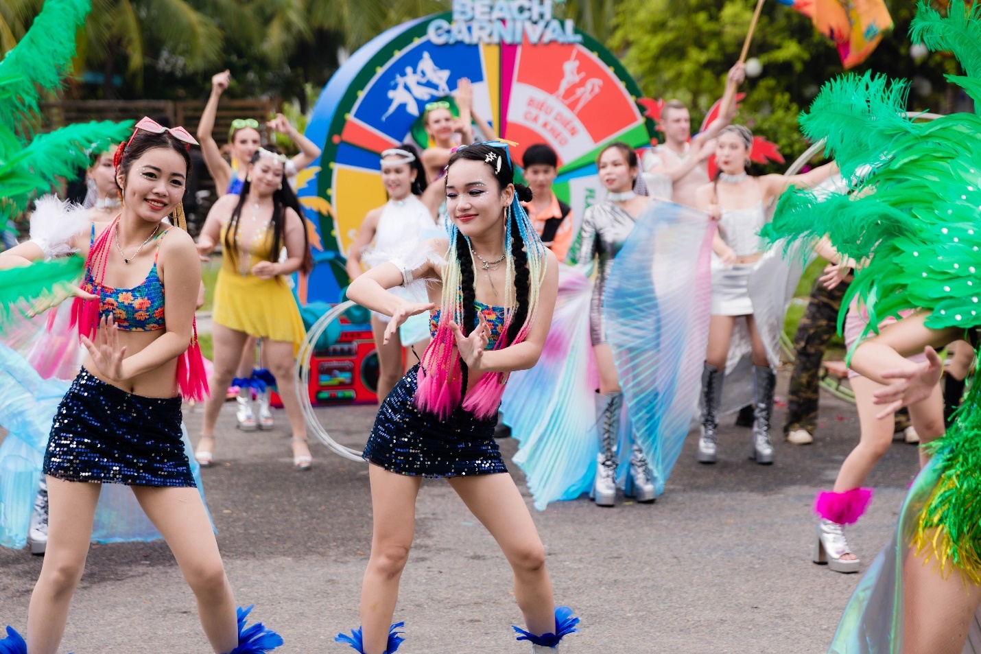 A group of women dancing in a parade  Description automatically generated