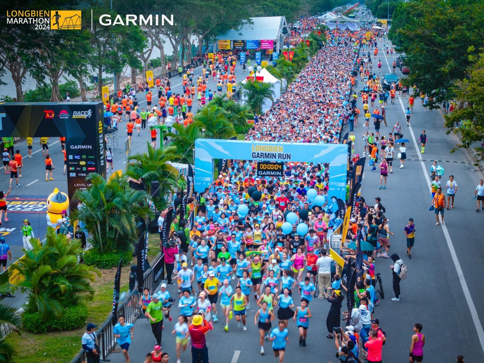 A group of people running on a street  Description automatically generated