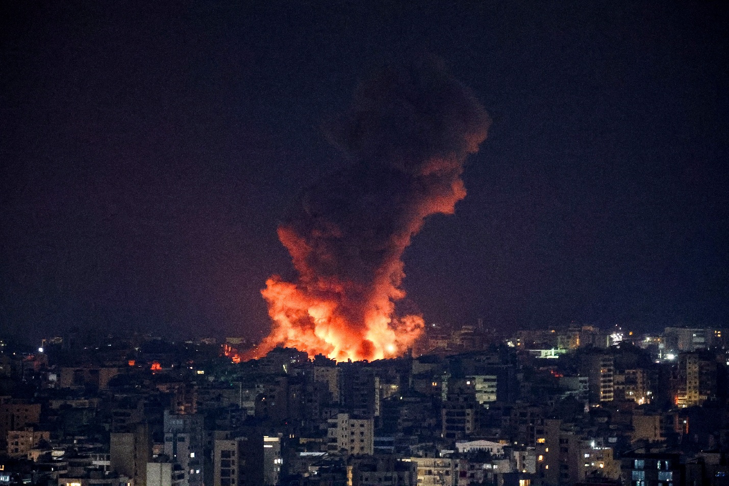 Smoke billows over Beirut's southern suburbs after a strike, amid ongoing hostilities between Hezbollah and Israeli forces