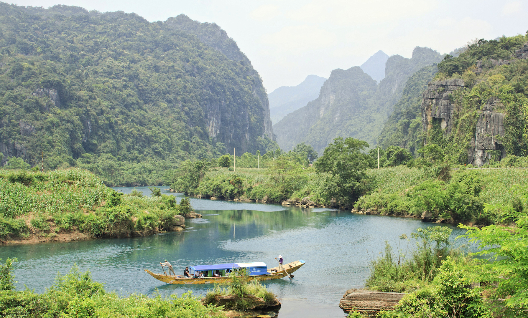A boat on the river among the limestone mountains of Phong Nha - Ke Bang