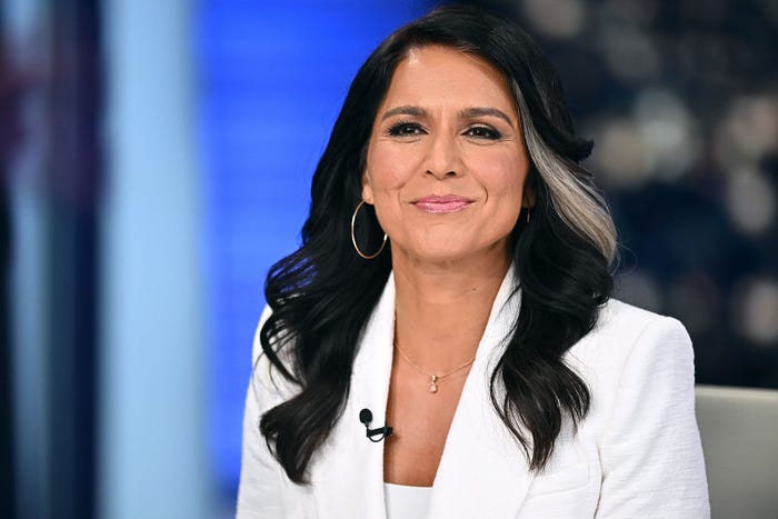 former congresswoman Tulsi Gabbard in a white suit
