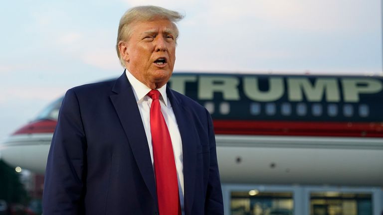 Former President Donald Trump speaks with reporters before departure from Hartsfield-Jackson Atlanta International Airport, Thursday, Aug. 24, 2023, in Atlanta. (AP Photo/Alex Brandon)