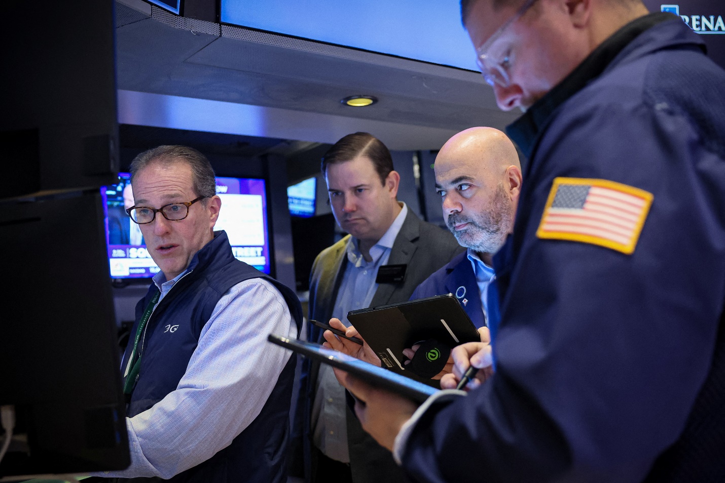 Traders work on the floor of the NYSE in New York