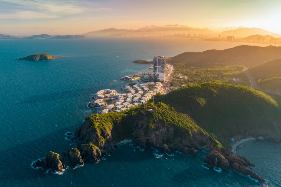 A aerial view of a city on a rocky island  Description automatically generated