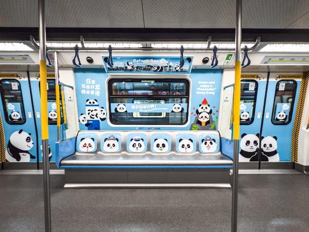 A blue subway with pandas on the side  Description automatically generated