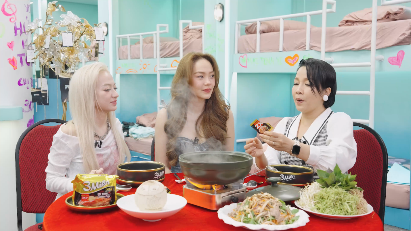 A group of women sitting around a table with food  Description automatically generated