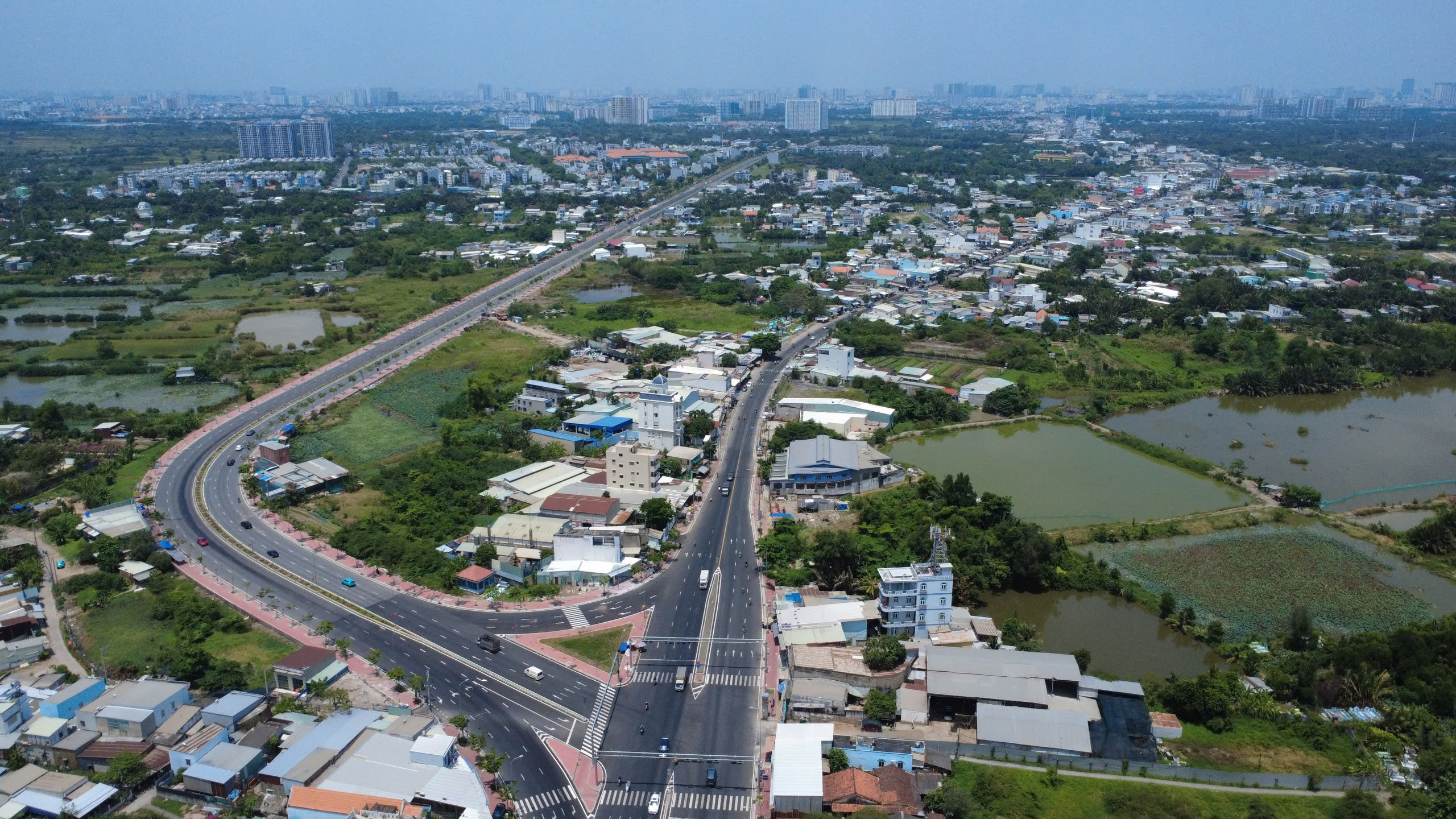 Th&ocirc;ng xe tạm cầu &Ocirc;ng Th&igrave;n th&uacute;c đẩy mở rộng Quốc lộ 50 năm 2026 - Ảnh 1.