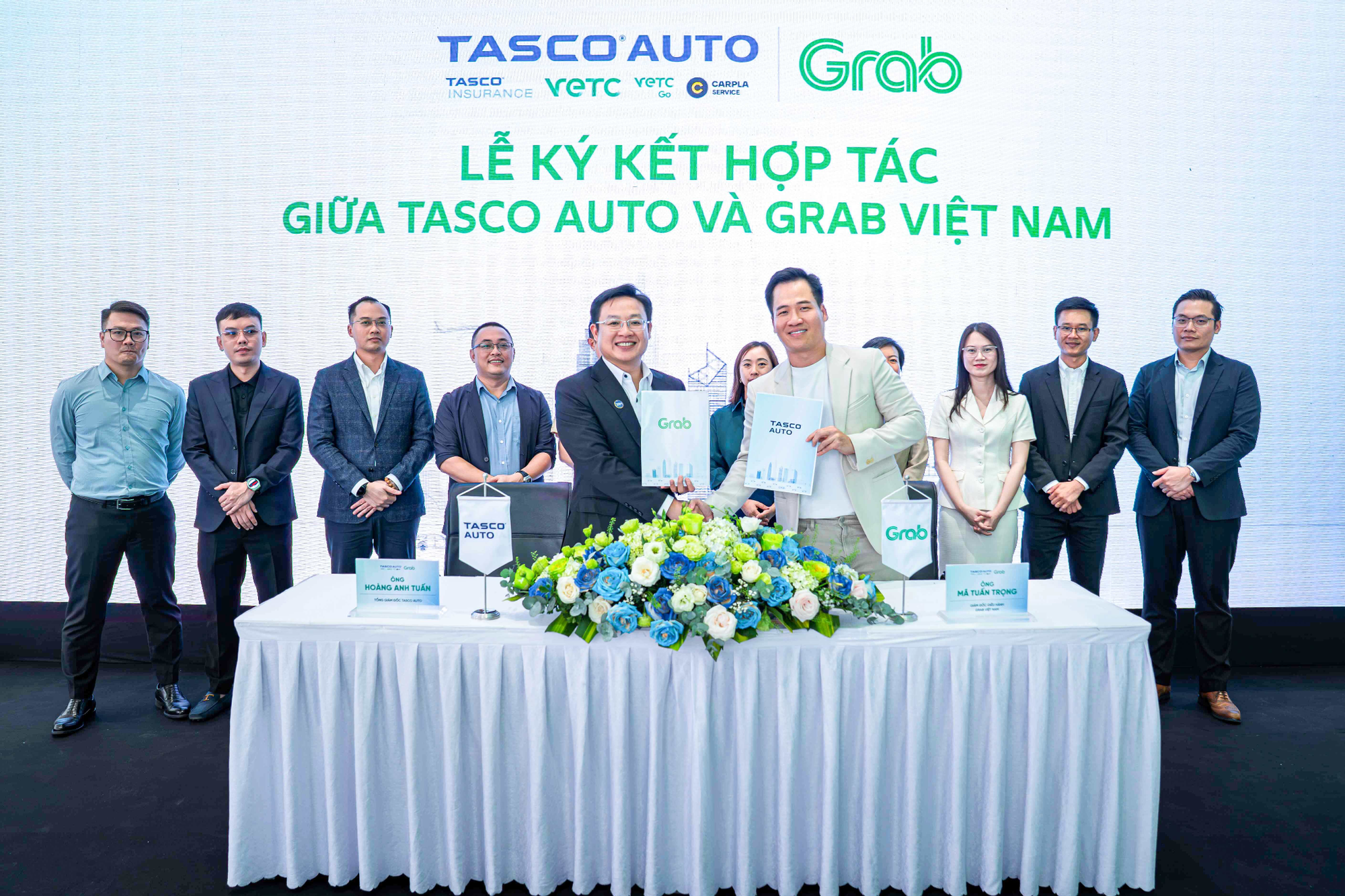 Grab Việt Nam và Tasco Auto hợp tác toàn diện thúc đẩy chuyển đổi xanh tại Việt Nam - Ảnh 1.