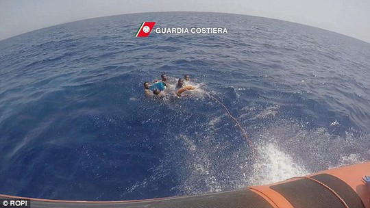 Rescued:  The heavily pregnant Nigerian woman had boarded an inflatable boat with some 100 other migrants and refugees