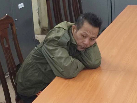 Nghi can Nguyễn Văn Kỳ sau khi bị bắt tại cơ quan công an