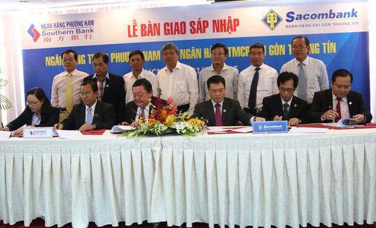 Lễ ký kết bàn giao sáp nhập Southern Bank vào Sacombank hôm 1-10