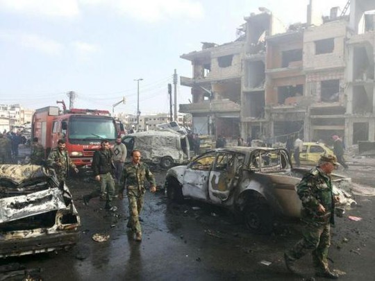 Các vụ đánh bom xe ở TP Homs ngày 21-2. Ảnh: Reuters