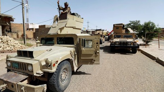 
Lực lượng quân đội Iraq tiến vào TP. Fallujah hôm 17-6. Ảnh: Reuters
