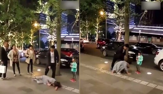 
Một người đàn ông đánh vợ giữa phố. Ảnh: shanghaiist
