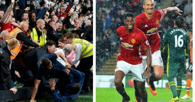 
CĐV M.U ăn mừng hỗn loạn trên khán đài sau bàn thắng của Rashford

